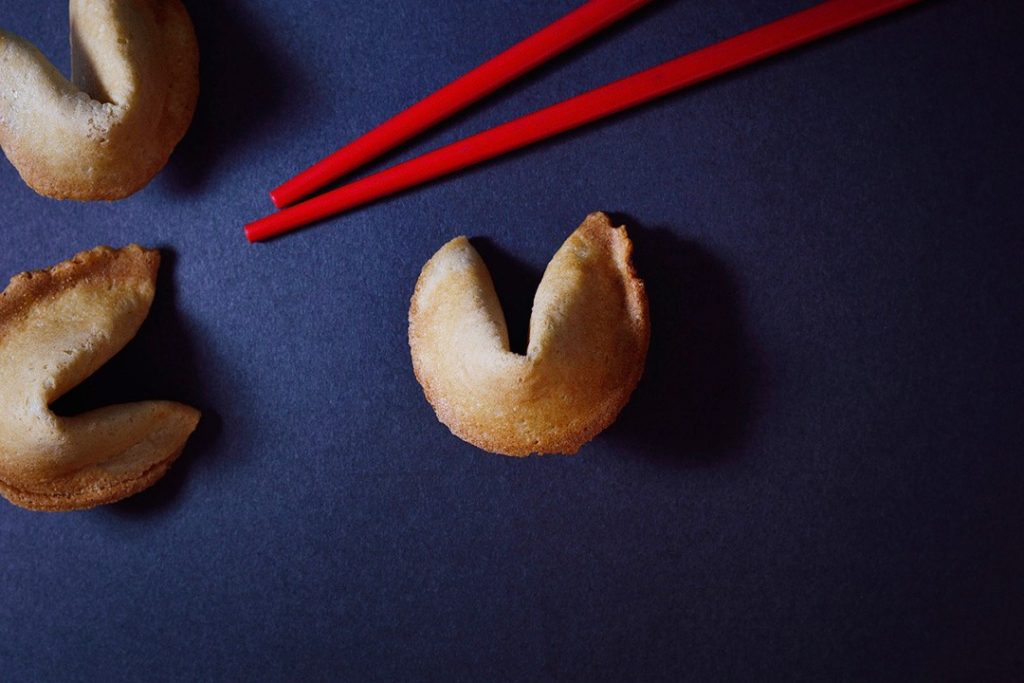 Improve marketing campaigns with predictive analytics Fortune cookie with red chopsticks