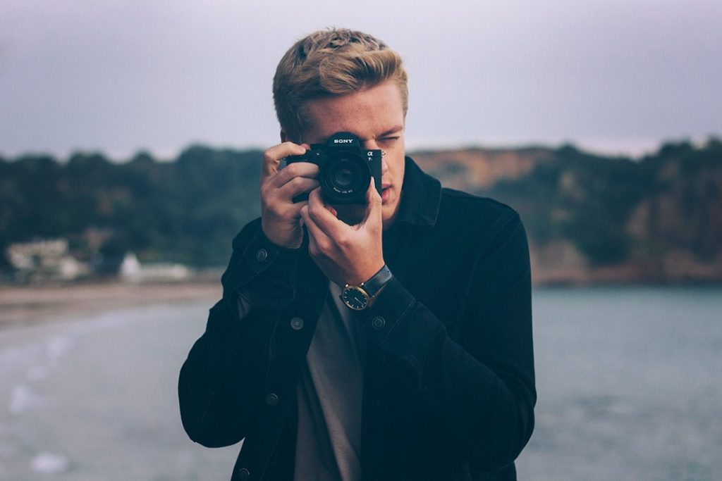 The basics of shooting manual photography Man using photography camera